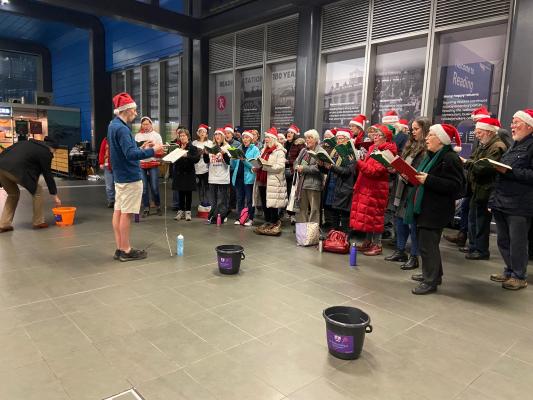 Carol singing at Reading station