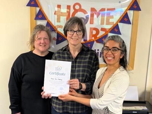 Herjeet from RVA presenting the certificate to Catherine and Kelly