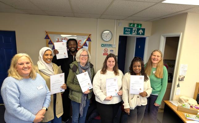 Five new volunteers with their certificates